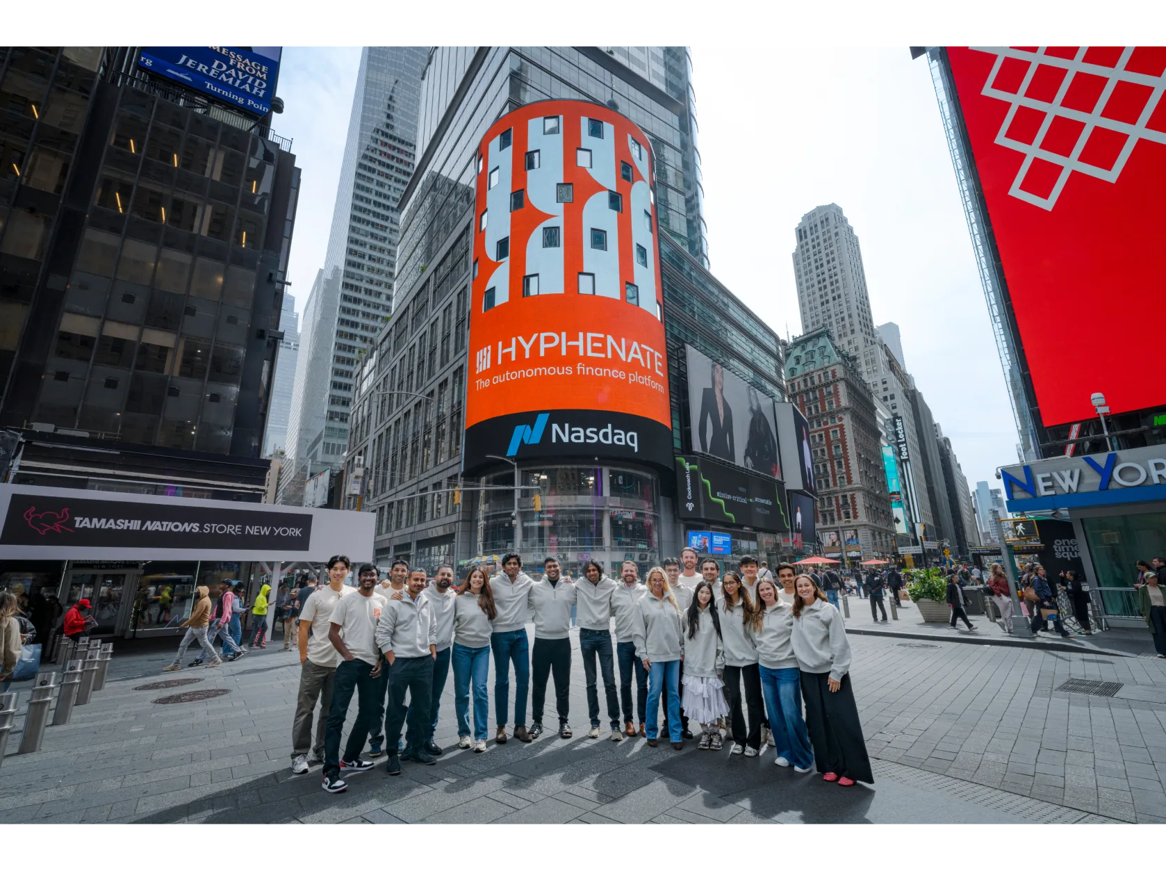 Hyphenate team in Times Square beneath the Nasdaq billboard
